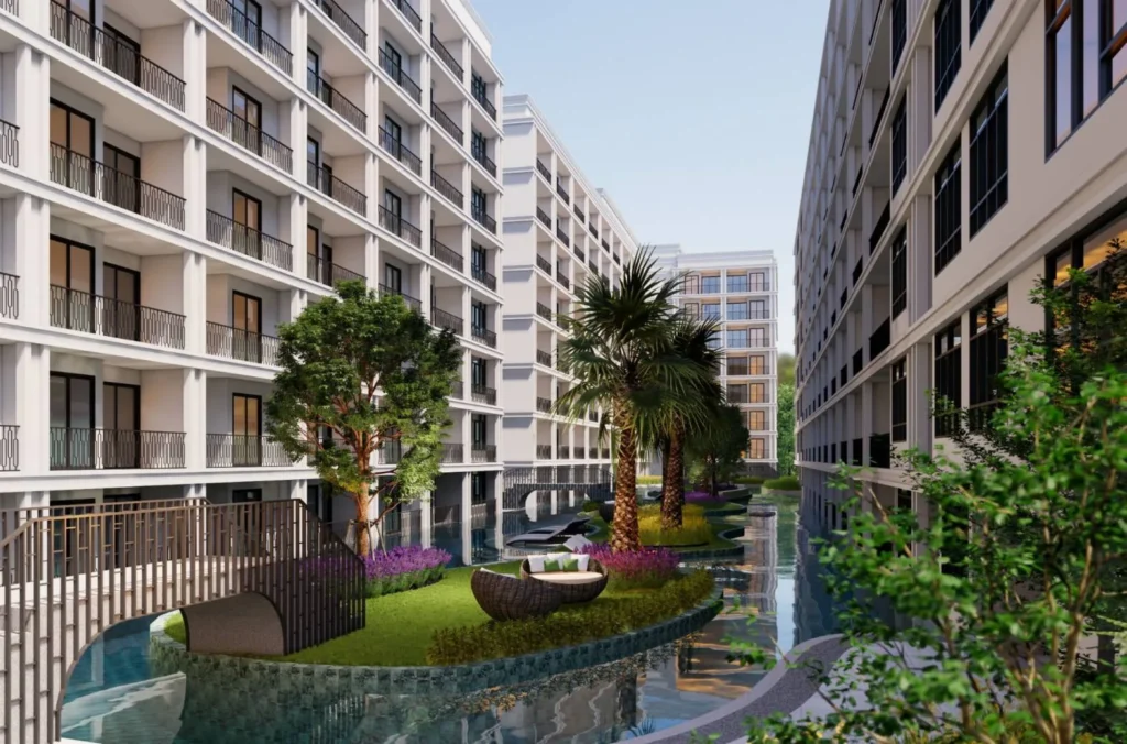 Зона отдыха с бассейном и ландшафтным дизайном в The Indeed Condo Pattaya | Resort-style swimming pool and landscaped courtyard at The Indeed Condo Pattaya